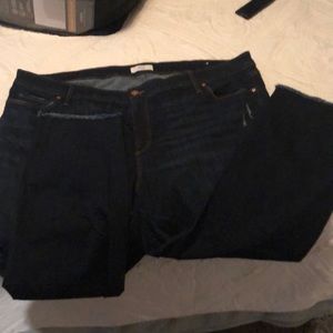 Dark wash jeans with frayed hem